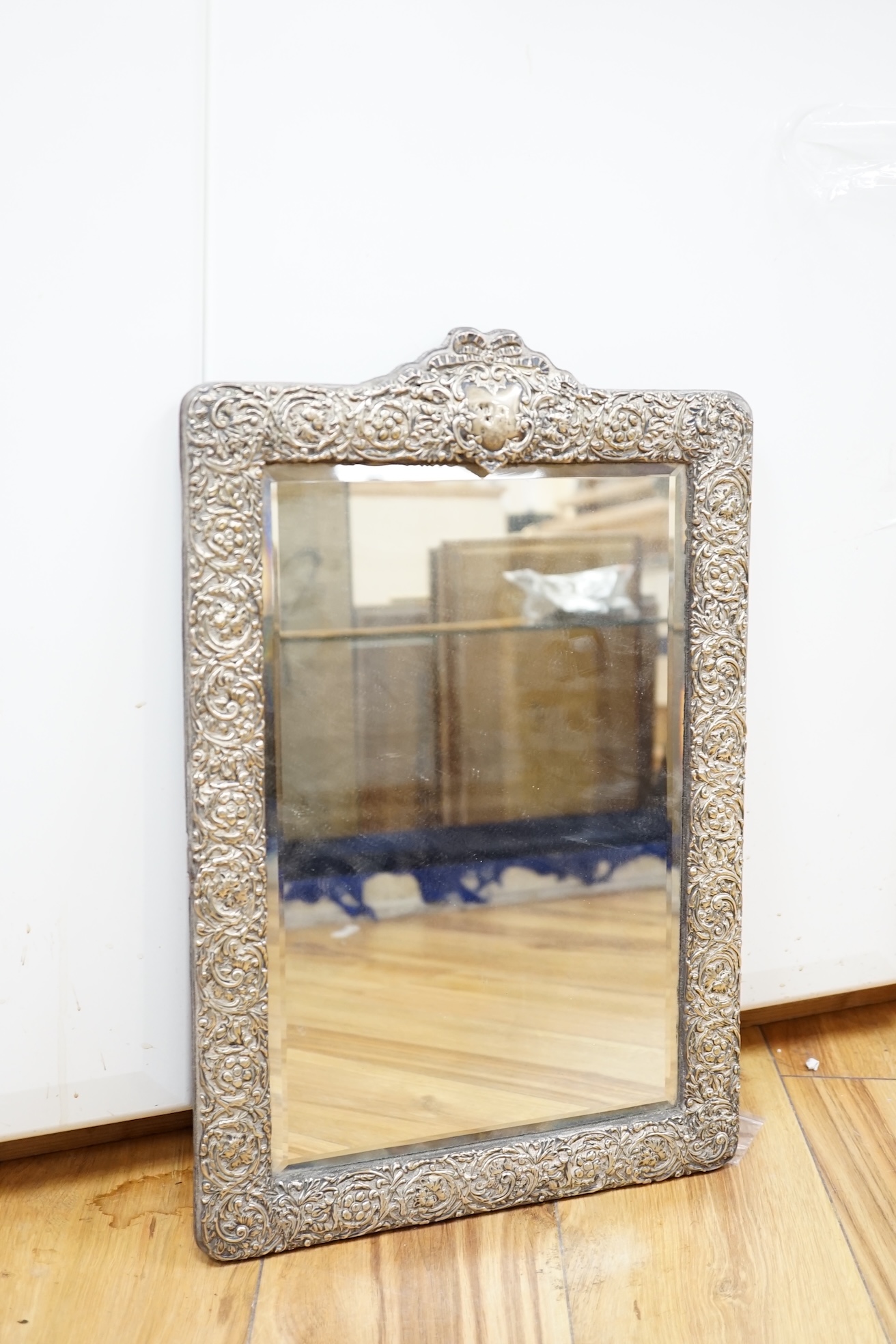 A large Edwardian repousse silver mounted easel mirror, Birmingham, 1905, 48.7cm. Condition - poor